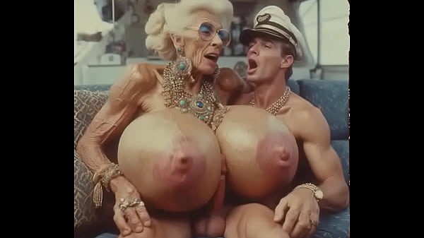 JAY7 Granny Boob Cruise 01 - AI VIDEO - A topless and horny granny with huge bolt-on tits gives a crazy titjob to the skipper